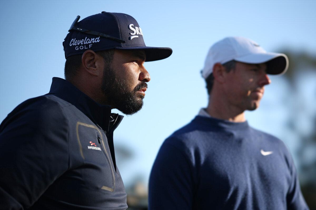 J.J. Spaun of the United States and Rory McIlroy of Northern Ireland look on from the 16th tee during the playoff in the final round of The Players Championship on the Stadium Course at TPC Sawgrass in Ponte Vedra Beach, Florida, on March 17, 2025. (Jared C. Tilton/Getty Images)