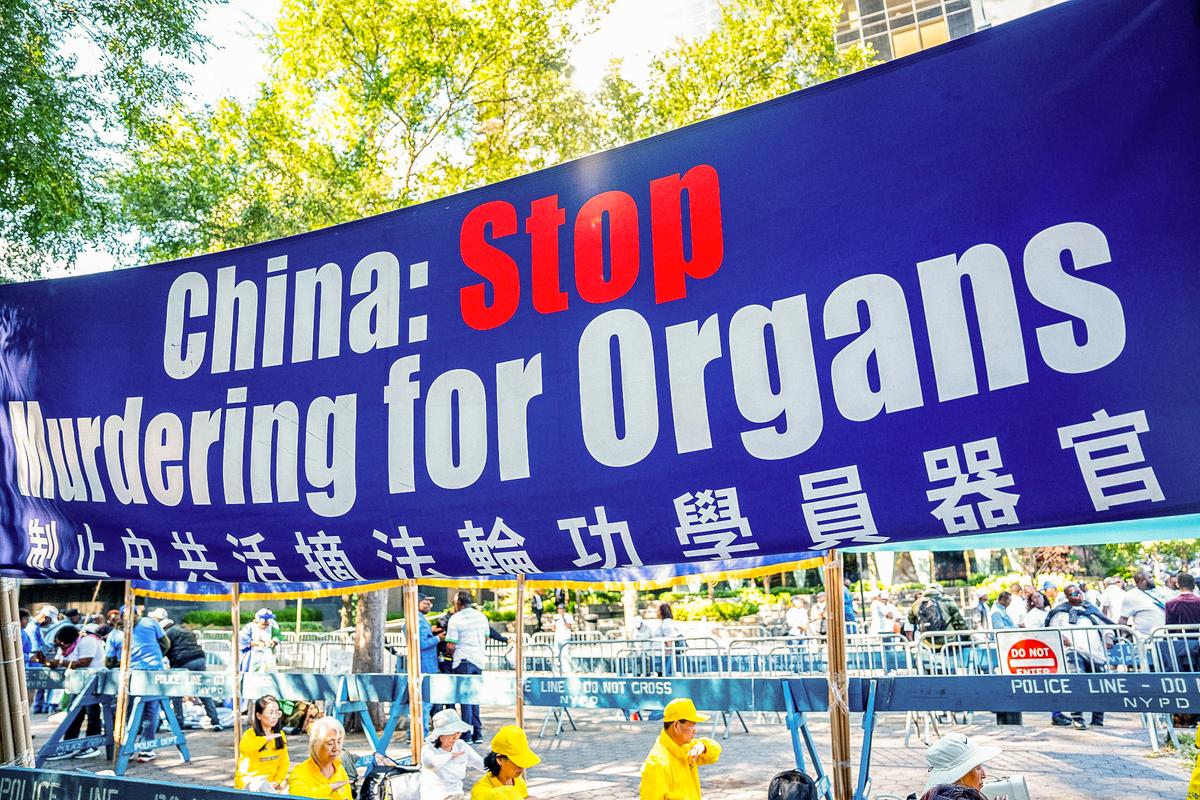 The banner calling for the end of the forced organ harvest from a Chinese practitioner of Falun Gong is on display as a sign of practicing spiritual practice meditation, next to the United Nations in New York City on September 20, 2023.