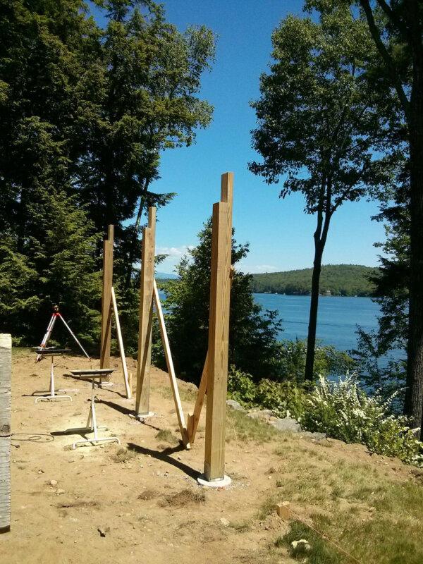 These 6x6 treated lumber posts need a few more braces before the long double 2x12 beam is set in the L-shaped notches. The optical builder's level on the tripod is used to ensure the seat of each notch is at the same elevation. (Tim Carter/Tribune Content Agency/TNS)