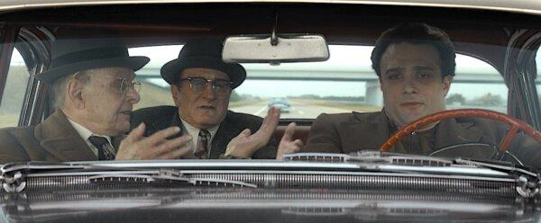 (L–R) Tony Bender (Robert Uricola), Vito Genovese (Robert De Niro), and Vincent Gigante (Cosmo Jarvis) in “The Alto Knights." (Warner Bros. Pictures)