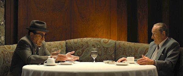 Vito Genovese (Robert De Niro, L) and Frank Costello (Robert De Niro) hash things out in an upscale restaurant, in “The Alto Knights." (Warner Bros. Pictures)