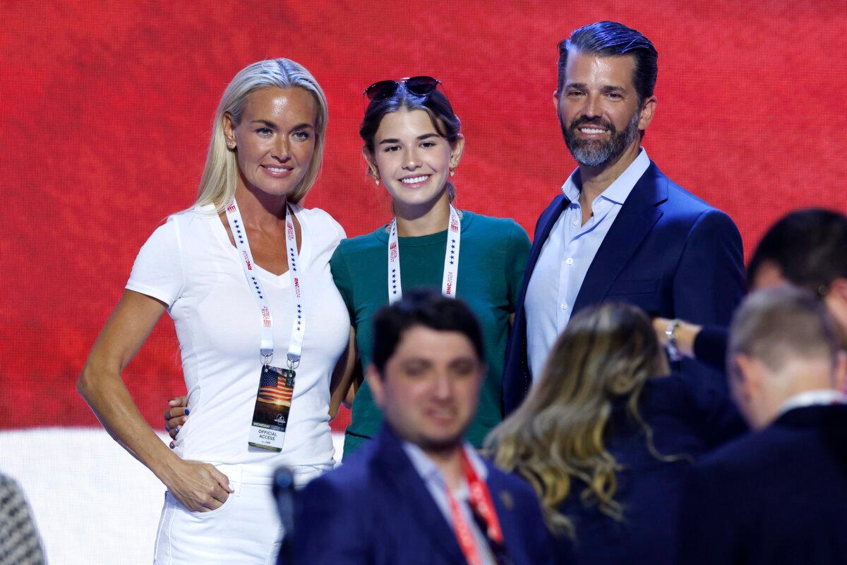 (L–R) Vanessa Trump, Kai Trump, and Donald Trump Jr., stand on stage before the start of the third day of the Republican National Convention at the Fiserv Forum in Milwaukee, Wis., on July 17, 2024. (Chip Somodevilla/Getty Images)
