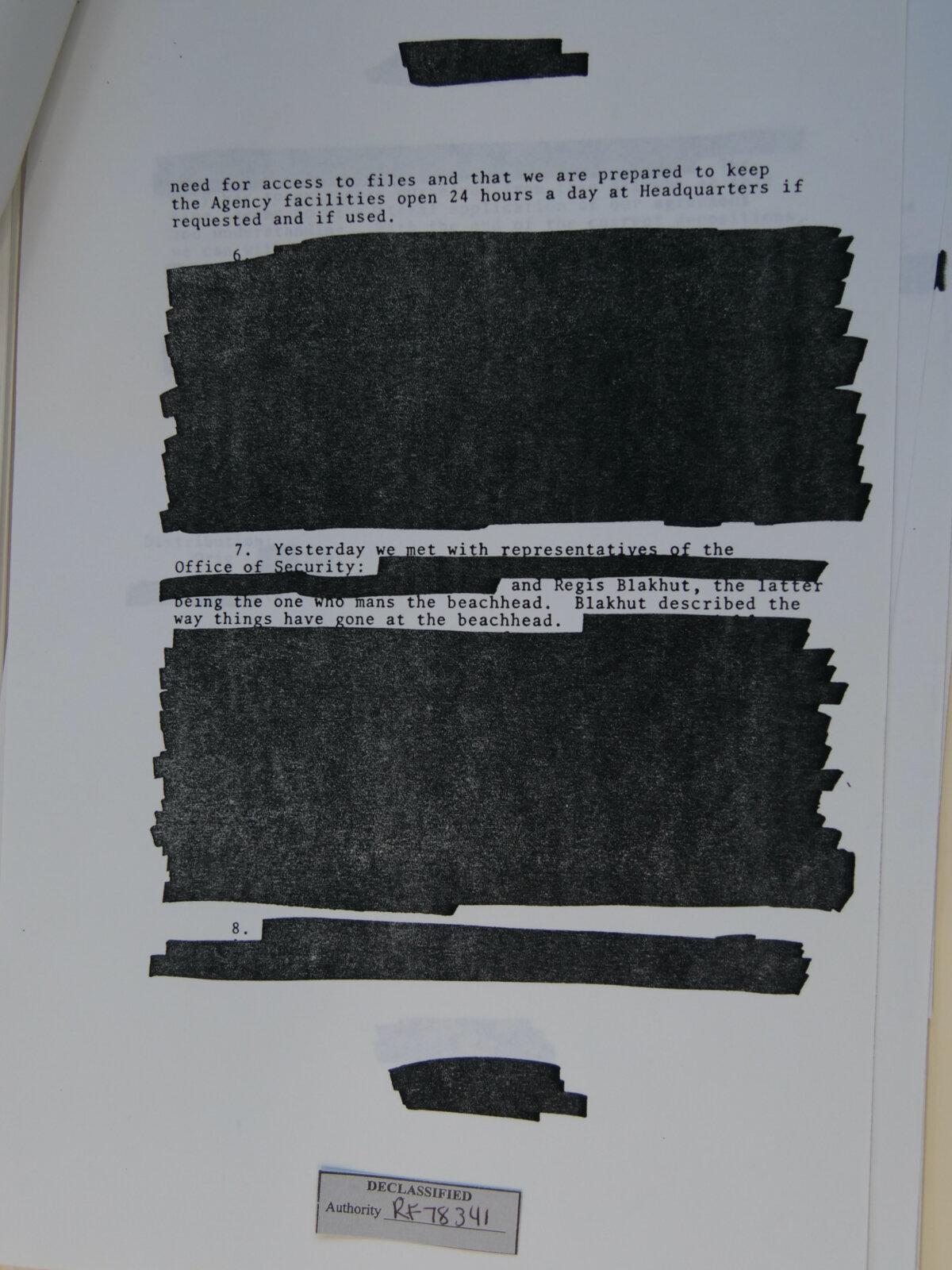Example of a "sanitized" document in the files of Russell Holmes provided to the National Archives by the CIA, as pictured March 21, 2025. (Travis Gillmore/The Epoch Times)