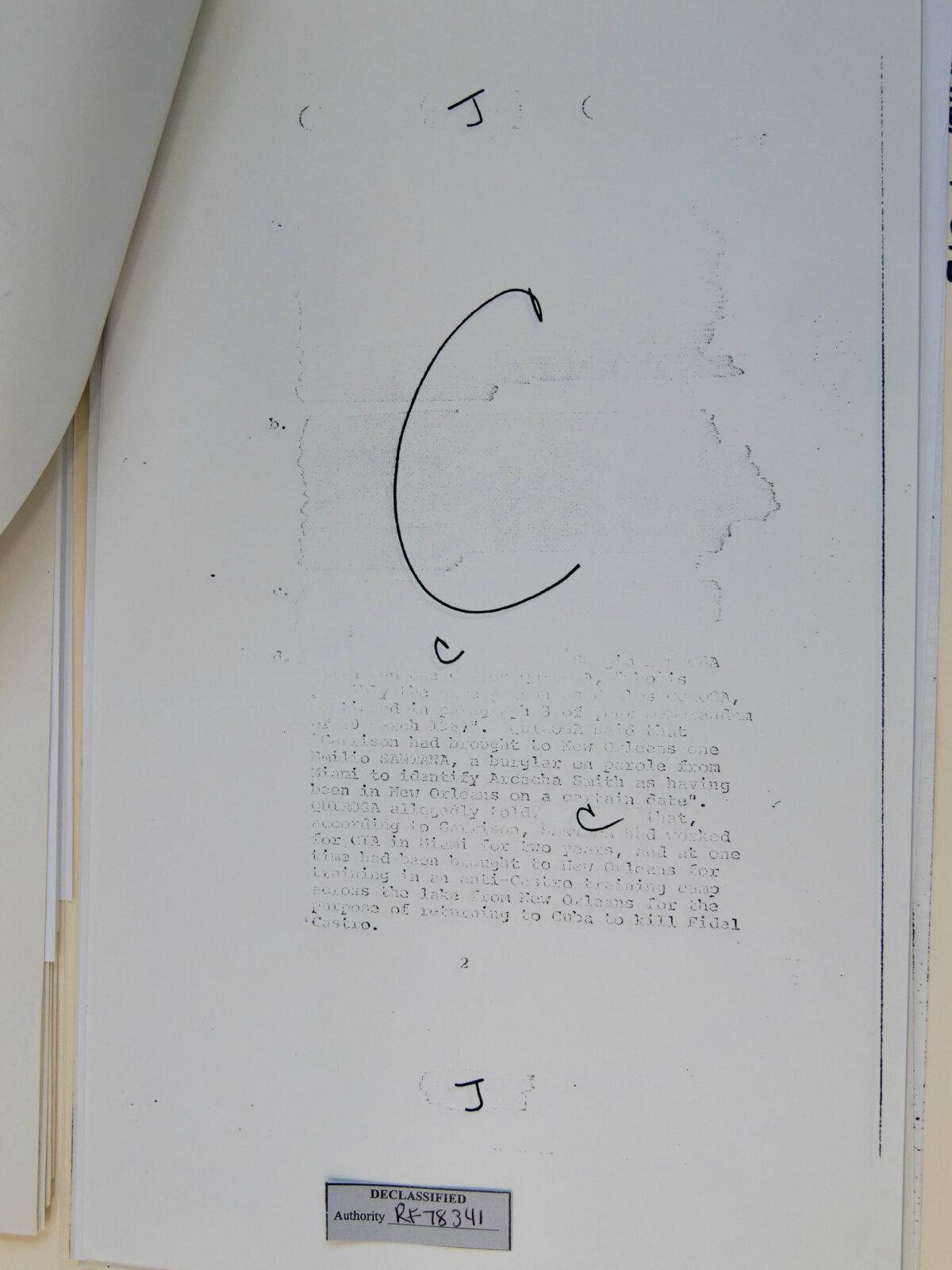 Some JFK files in the archives, such as this document pictured on March 21, 2025, are heavily redacted or illegible, making review challenging for researchers. (Travis Gillmore/The Epoch Times)