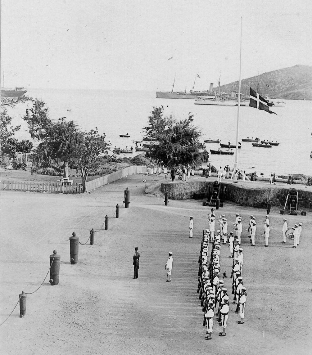 The Danish flag is lowered at the Governor's Mansion at St. Croix for the last time, March 31, 1917. (Public Domain)