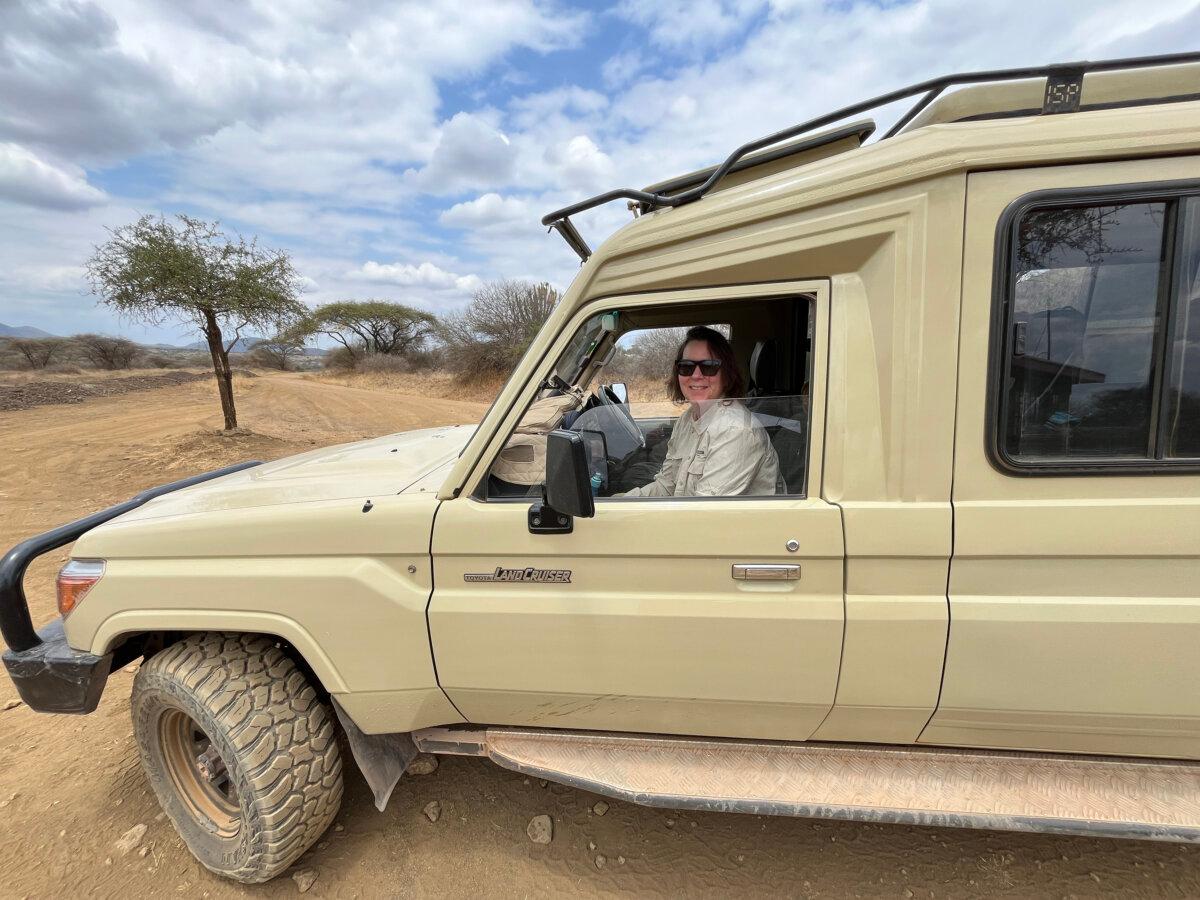 Sue Campbell in guide Chris Angell's Toyota Land Cruiser, where the group spent most of their time on safari. (Steve Nordgaard/TNS)