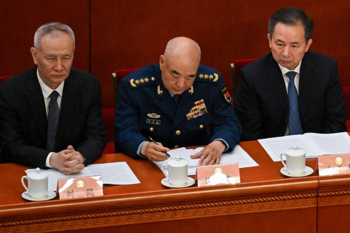 Li Ganjie (R) attends the opening ceremony of the Chinese People's Political Consultative Conference (CPPCC) in Beijing on March 4, 2023. (Noel Celis/AFP via Getty Images)