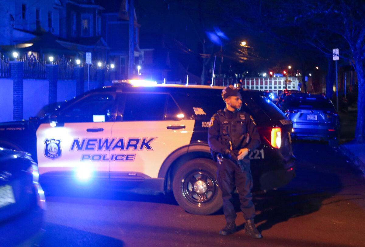 Law enforcement officers will investigate the scene after two police officers were shot dead in Newark, New Jersey on March 7, 2025 (ED MURRAY/NJ Advance Media via the AP)