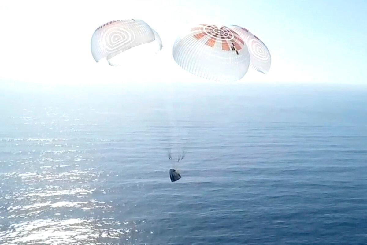 A Dragon capsule carrying four space tourists prepares to splash down in the Pacific Ocean off the coast of California on April 4, 2025, in a still from video. (SpaceX via AP)