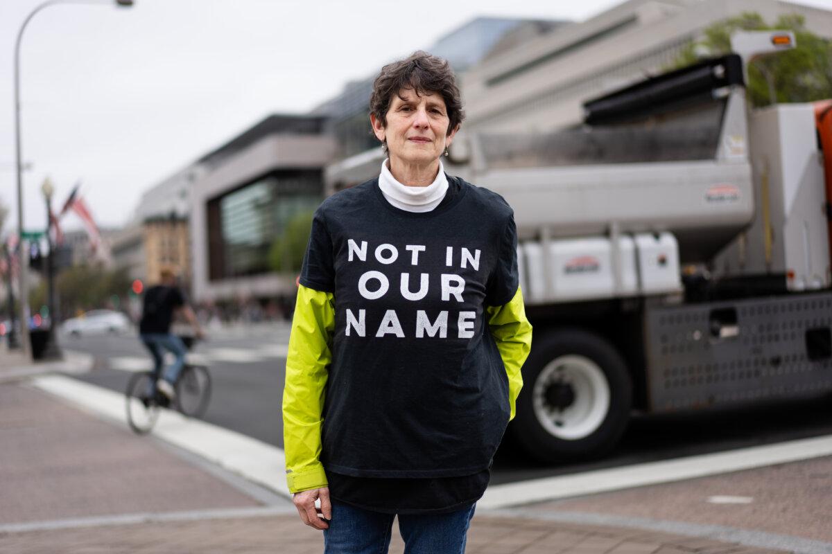 Renee Steinhagen takes part in a protest against President Donald Trump and his adviser overseeing DOGE, Elon Musk, in Washington on April 5, 2025. (Madalina Vasiliu/The Epoch Times)