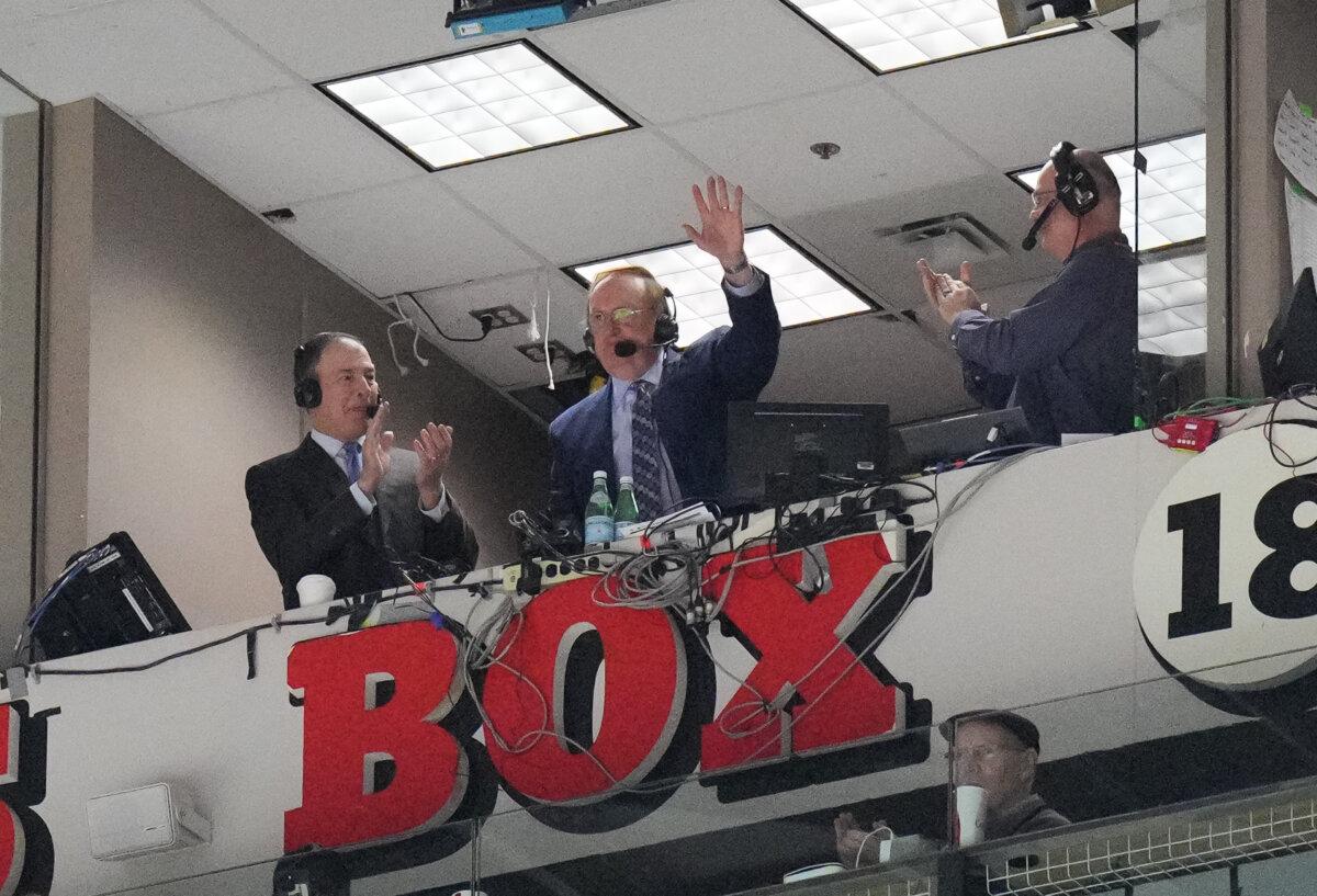 Sam Rosen, commentator of the New York Rangers, salutes the crowd after being honoured for his retirement following the season as the New York Rangers play the Ottawa Senators at Canadian Tire Centre in Ottawa, Ontario, Canada, on March 8, 2025. (Chris Tanouye/Freestyle Photography/Getty Images)