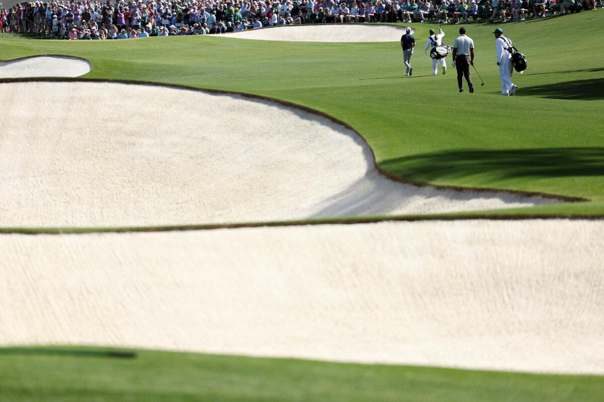 Tiger Woods of the United States and Will Zalatoris of the United States walk on the 18th hole during a practice round prior to the 2024 Masters Tournament at Augusta National Golf Club in Augusta, Ga., on April 8, 2024. (Warren Little/Getty Images)