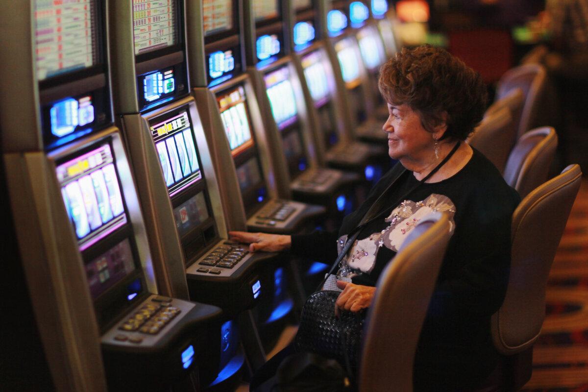 A woman plays a slot machine during the grand opening of the newest building at the Seminole Casino Coconut Creek in Coconut Creek, Fla., on Dec. 17, 2010. (Joe Raedle/Getty Images)