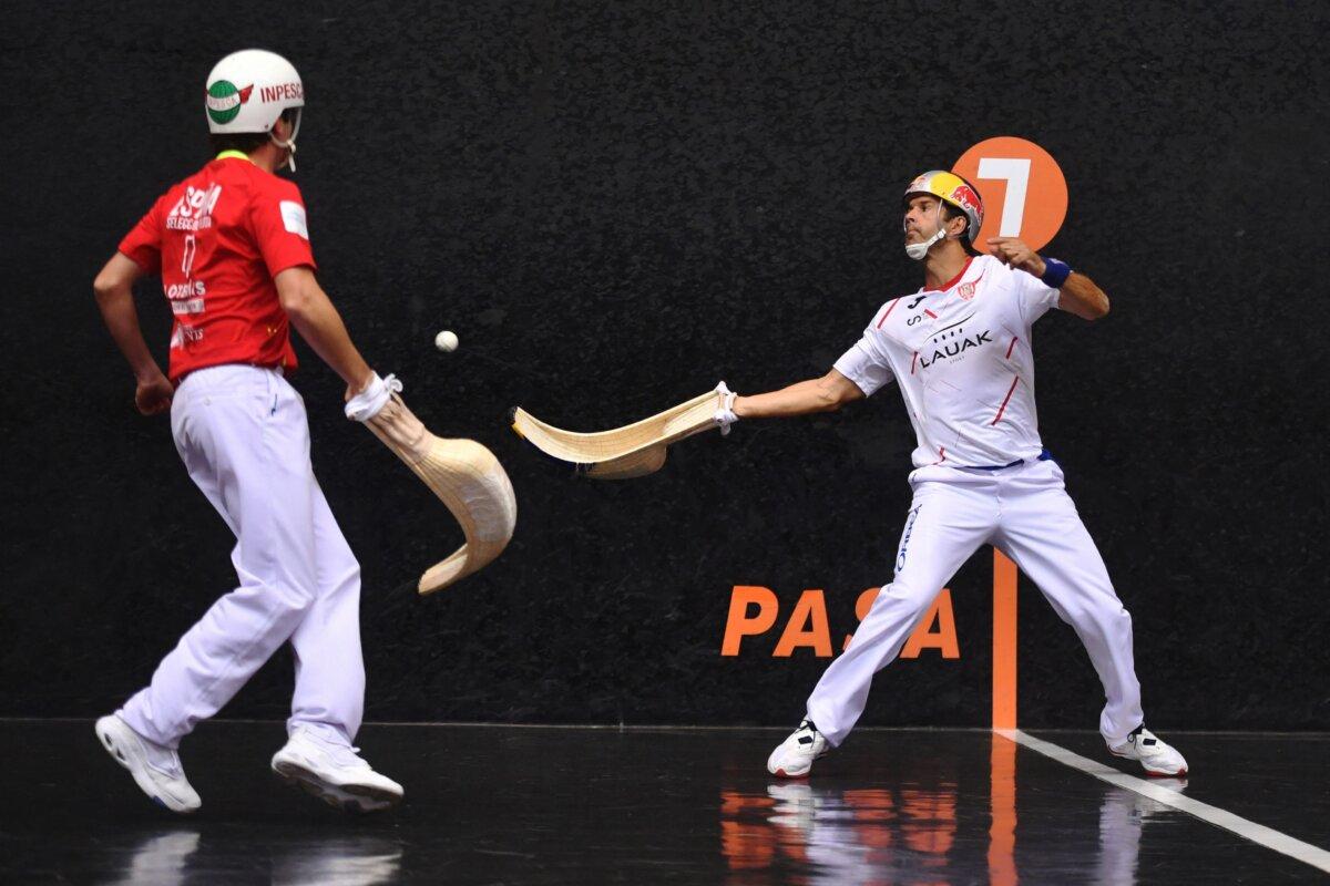 Jai alai player Inaki Goicoechea (R) takes a shot during the Cesta Punta Final match of the Basque Pelota World Championships in Biarritz, France, on Oct. 29, 2022. (Gaizka Iroz/AFP via Getty Images)