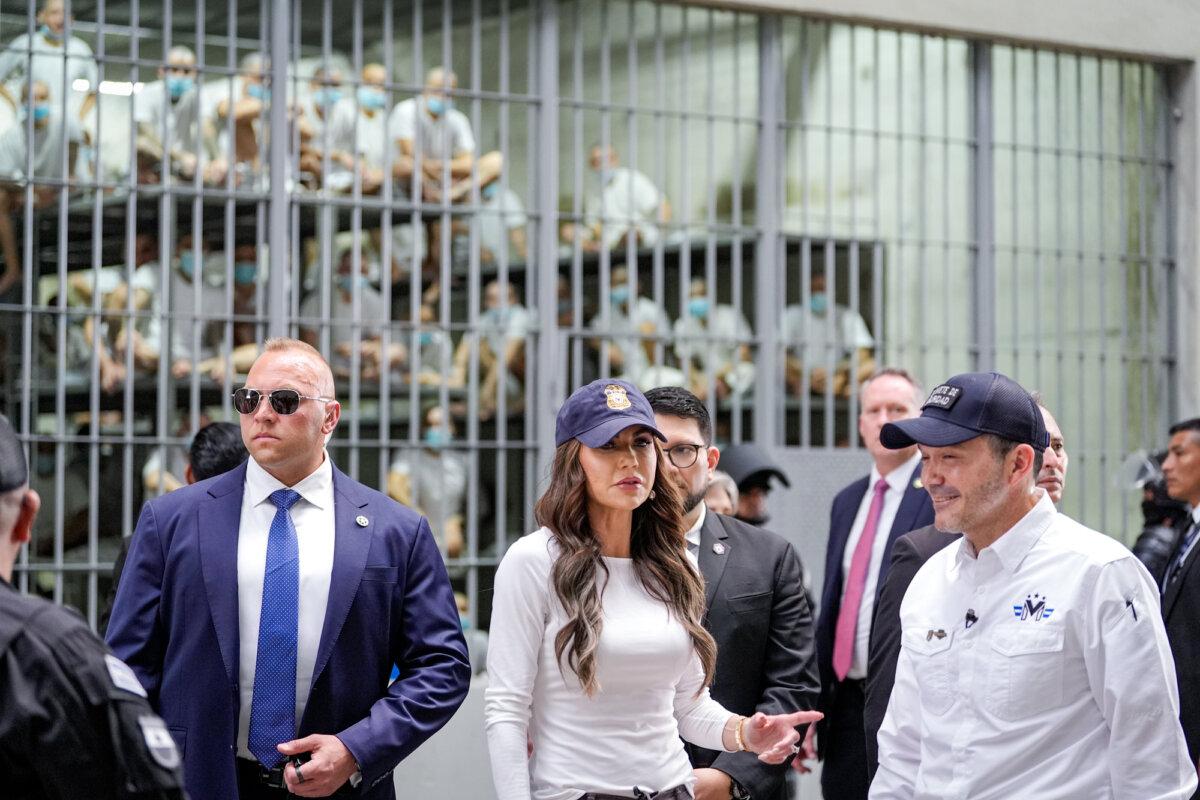 Homeland Security Secretary Kristi Noem, accompanied by Minister of Justice and Public Security Héctor Gustavo Villatoro (R), tours the Terrorist Confinement Center (CECOT) in Tecoluca, El Salvador, on March 26, 2025. (Alex Brandon/Getty Images)