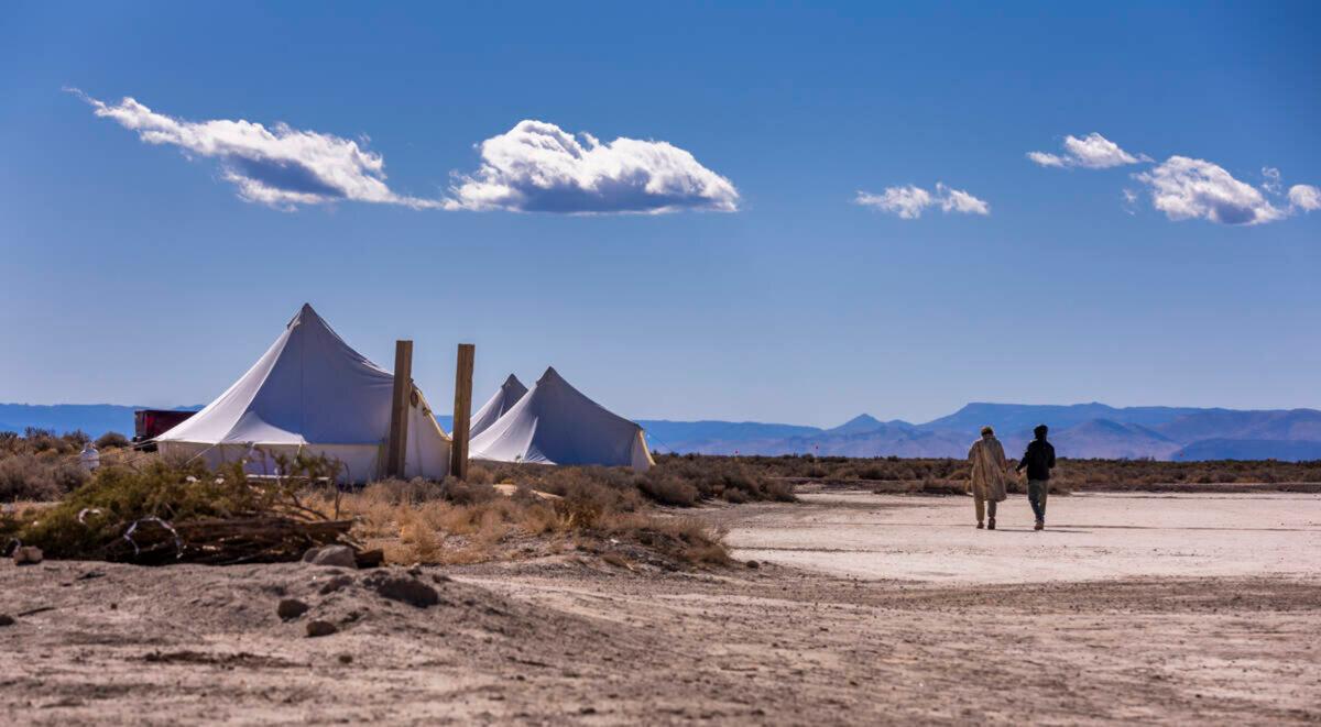 Guests walk to their tent at OutpostX in Beryl, Utah. (L.E. Baskow/Las Vegas Review-Journal/TNS)