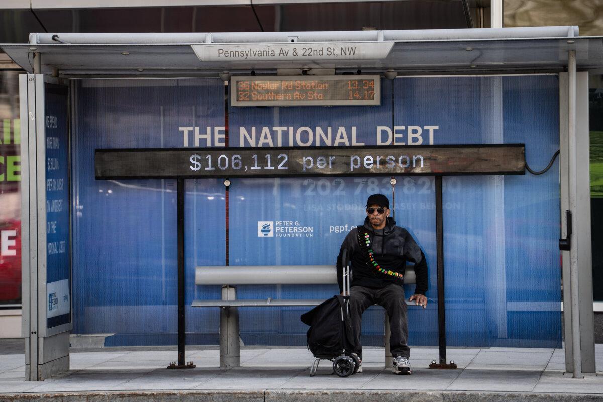The national debt clock is displayed at a bus station in Washington on April 14, 2025. (Madalina Vasiliu/The Epoch Times)