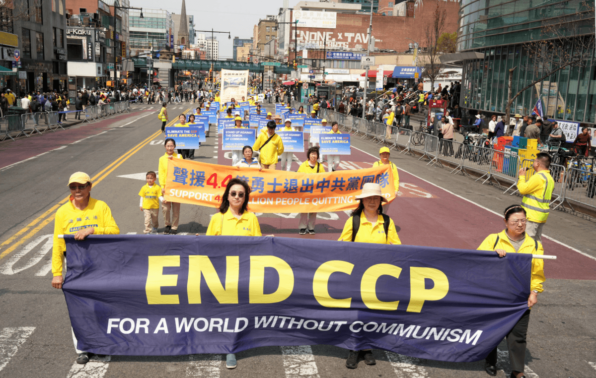 Falun Gong practitioners attend a parade to call for the end of the Chinese Communist Party's persecution of the group in China and to support the hundreds of millions who have quit the Chinese Communist Party. (Larry Dye/The Epoch Times)