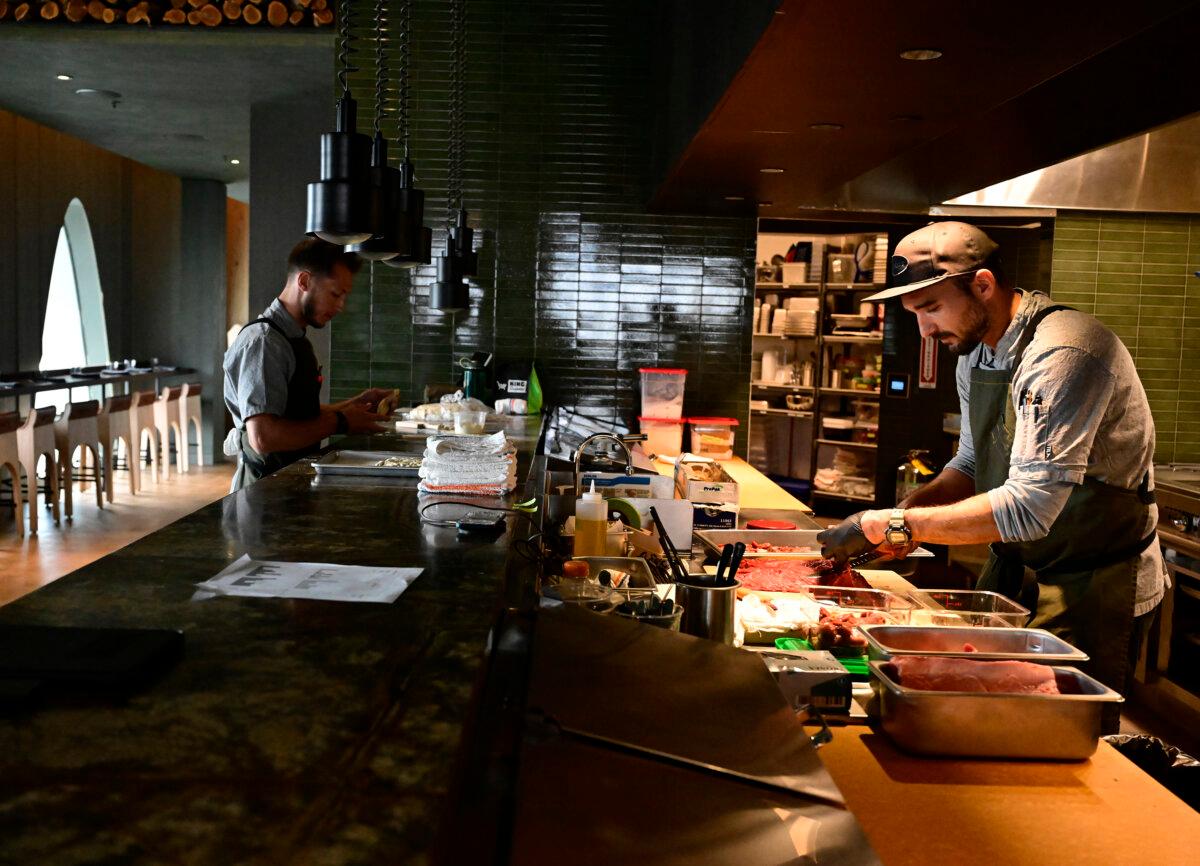 Sous chef Blaise Colamarino (L) and chef de cuisine Efe Taslik prepare for a meal service at the Stellar Jay restaurant on the rooftop of the new Populus Hotel in downtown Denver on Oct. 17, 2024. (Andy Cross/The Denver Post/TNS)