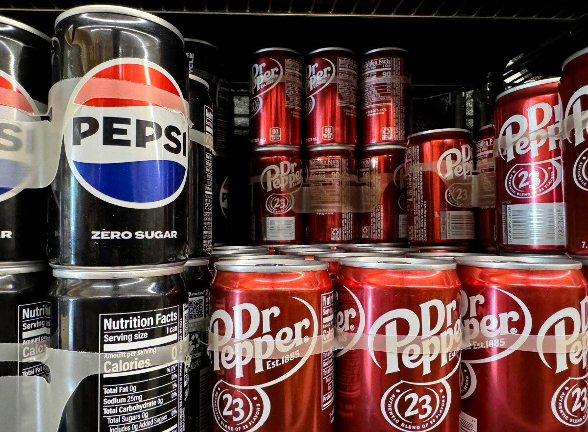 Keurig Dr Pepper and JDE Peet’s Merge to Create 2 Global Beverage Firms 2 Cans of Dr. Pepper and Pepsi are displayed on a shelf at a grocery store in San Anselmo, Calif., in a file photo. (Justin Sullivan/Getty Images)