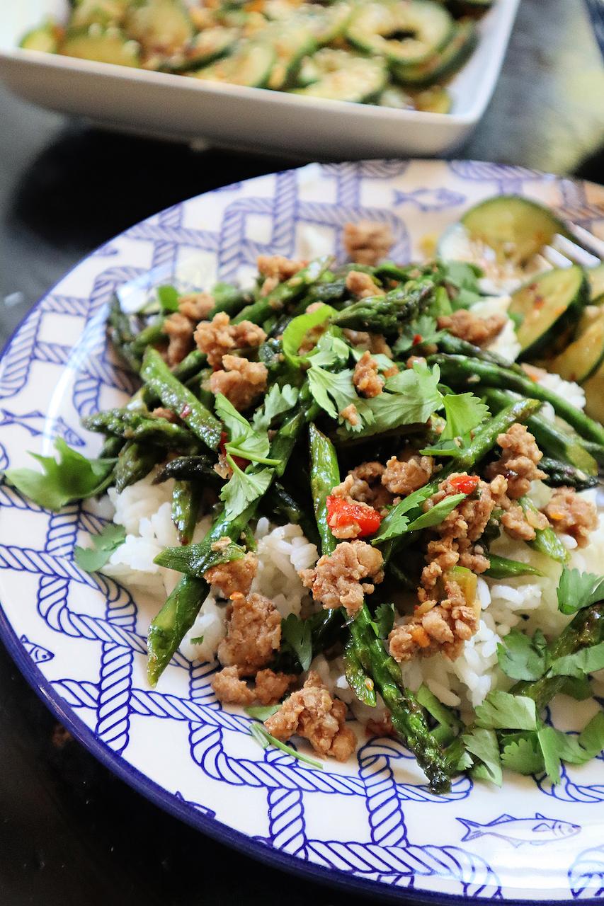 Thin stalks of spring asparagus are blistered, then tossed with ground pork, garlic, ginger, and soy sauce. (Gretchen McKay/Pittsburgh Post-Gazette/TNS)