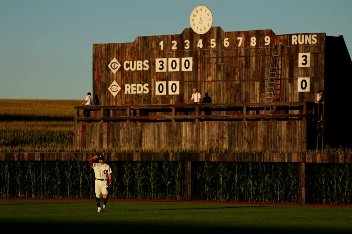 Seiya Suzuki of the Chicago Cubs shields his eyes from the sun against the Cincinnati Reds at Field of Dreams in Dyersville, Iowa, on Aug. 11, 2022. (Michael Reaves/Getty Images)