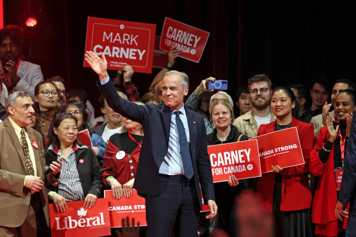 Liberals Win Canadian Election, Set to Form Minority Government | USNN World News Canada's Prime Minister and Liberal Party leader Mark Carney waves to supporters at a victory party in Ottawa on April 29, 2025. (Dave Chan/AFP via Getty Images)