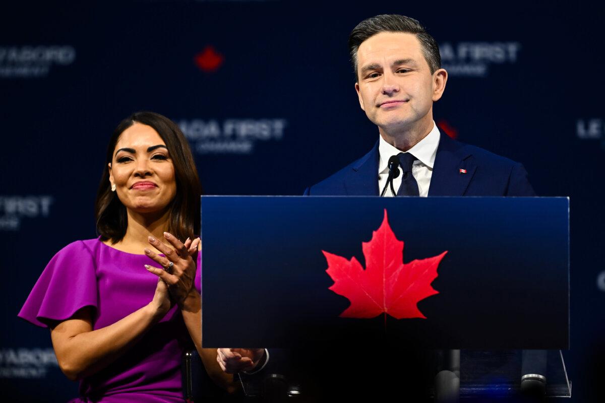 Conservative Leader Pierre Poilievre speaks to his supporters alongside his wife, Anaida Poilievre, after the April 28 federal election, in Ottawa on April 29, 2025. (Minas Panagiotakis/Getty Images)