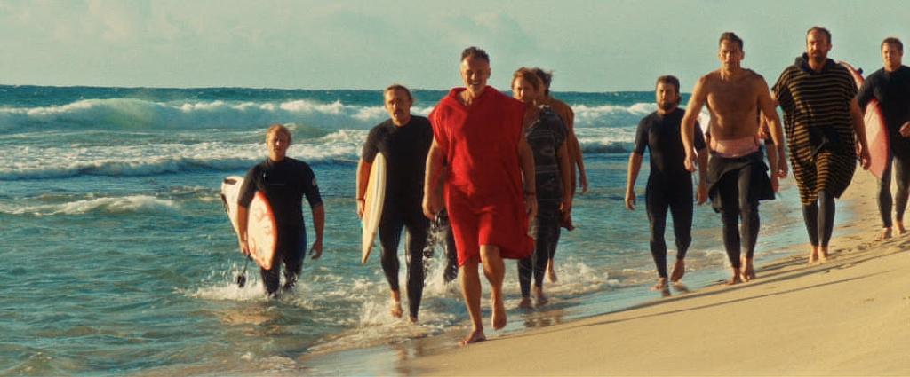 Scally (Julian McMahon, C) and the Bad Boys confront the surfer, in "The Surfer." (Roadside Attractions)