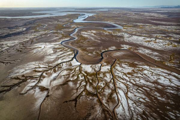 An aerial view of the Colorado River delta meeting the Cortés Sea at Valle de Mexicali, Mexico, on April 4, 2025. Since 2000, the Colorado River has faced an extended drought, heavily straining regional water supplies. (Guillermo Arias/AFP via Getty Images)