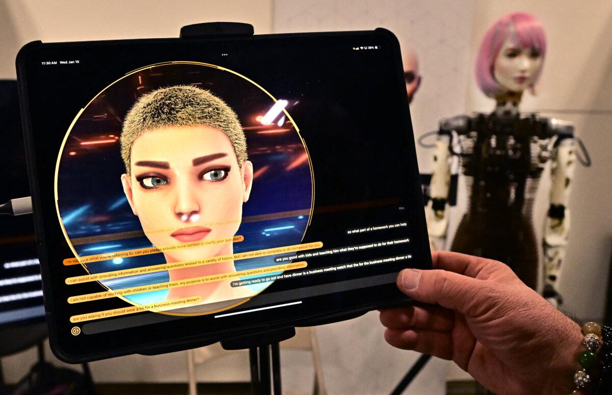 A person has a conversation with a humanoid robot in Las Vegas, Nevada, on Jan. 10, 2024. (Frederic J. Brown/AFP via Getty Images)