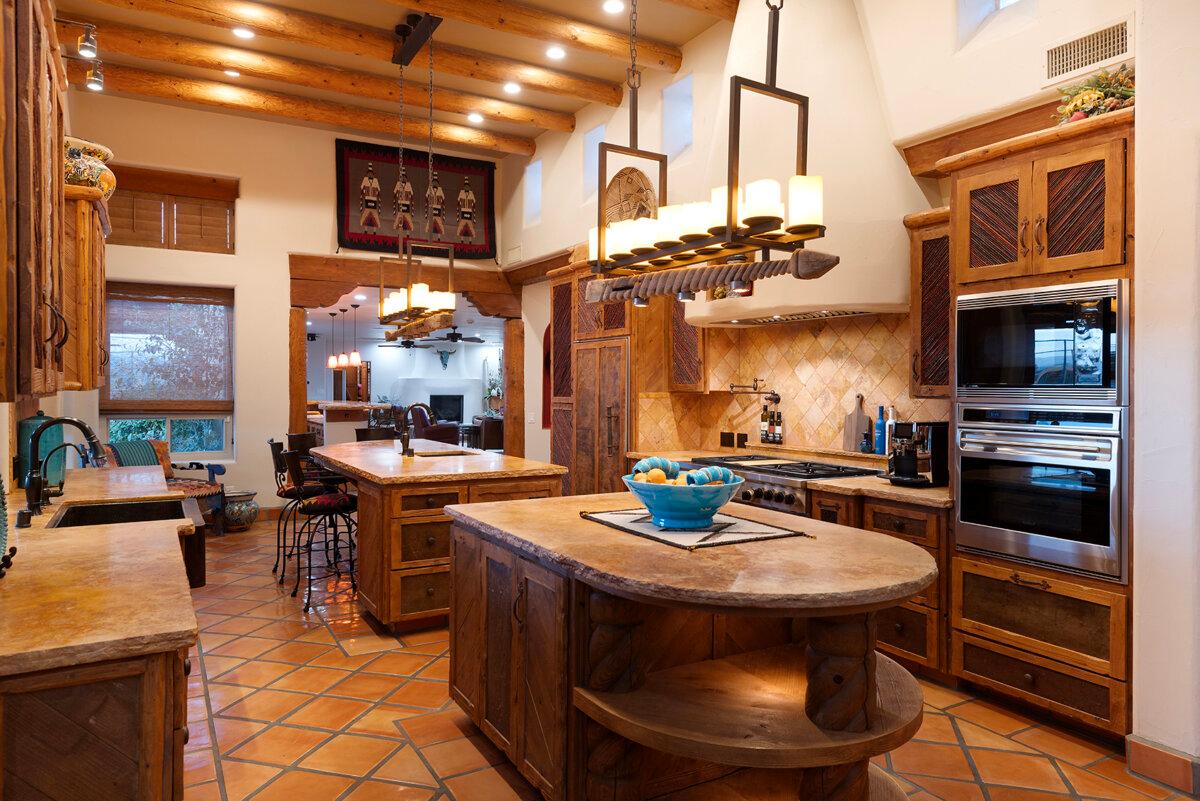 The kitchen has a wolf range, three ovens, a Sub Zero fridge, and two pantries. (Andrew Bramasco)