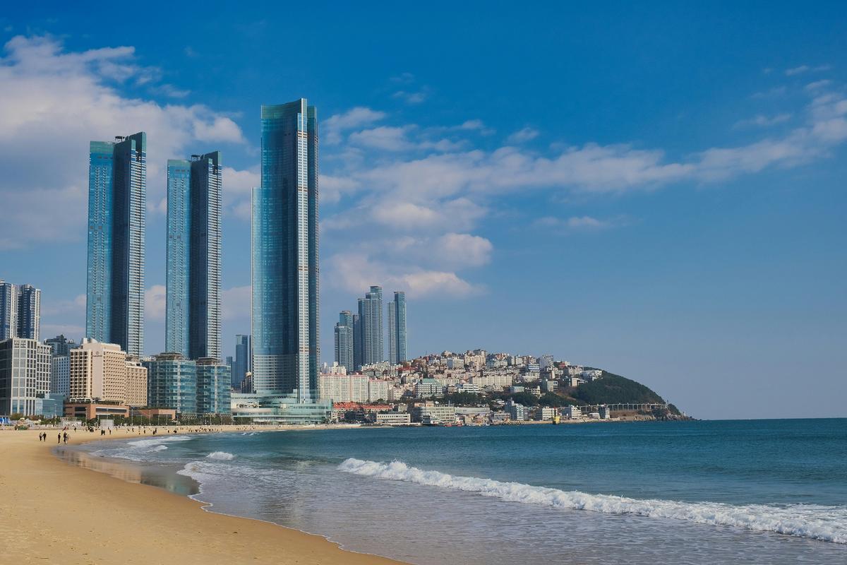 The white sands of Haeundae Beach make it a popular tourist destination and one of South Korea's most famous beaches. (Minku Kang/Unsplash)