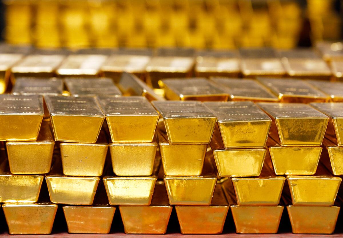 Gold bars are stacked in a vault at the U.S. Mint in West Point, N.Y. (Mike Groll/AP Photo)
