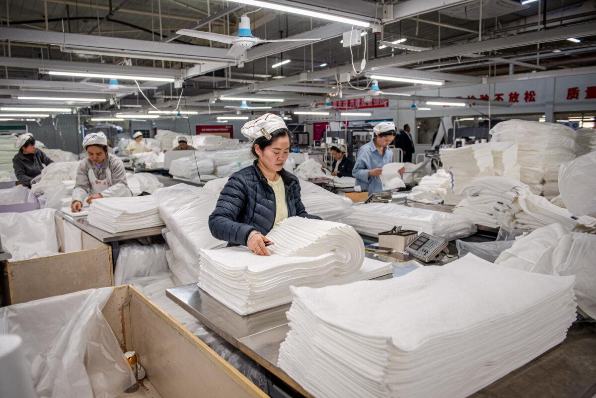 Employees work on a towel production line at a factory in Huaian, Jiangsu Province, China, on April 2, 2025. (AFP via Getty Images)