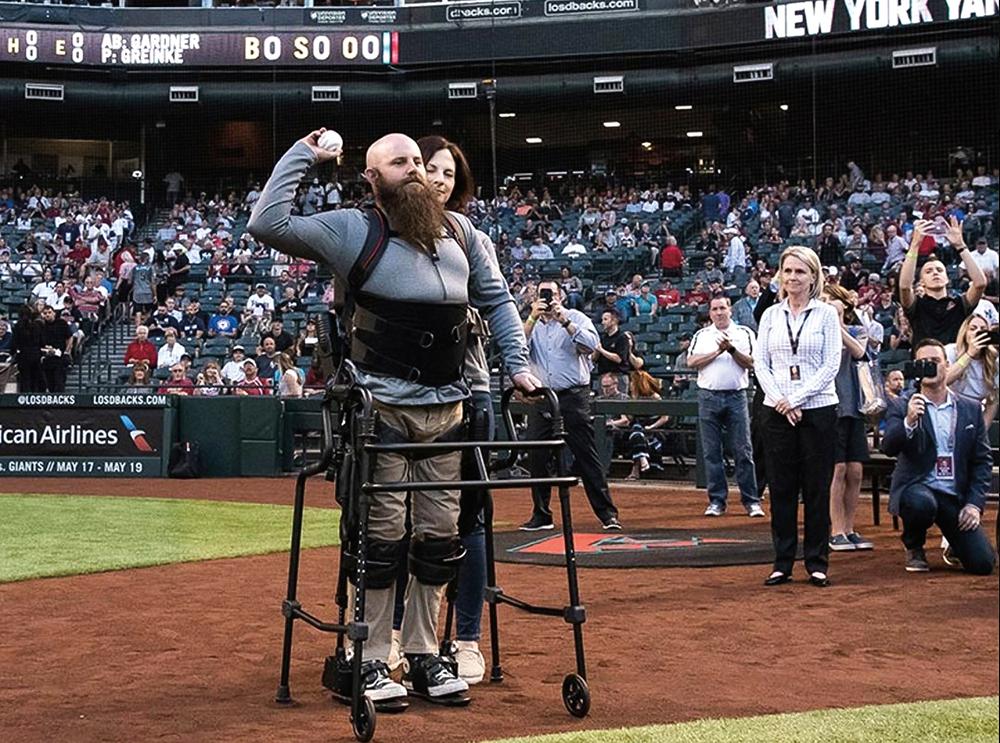 Sgt. Dan Rose throws the first pitch at an Arizona Diamondbacks game in 2017. Following a complete spinal rupture, he was the first SoldierSuit recipient. (Courtesy of Chris Meek)
