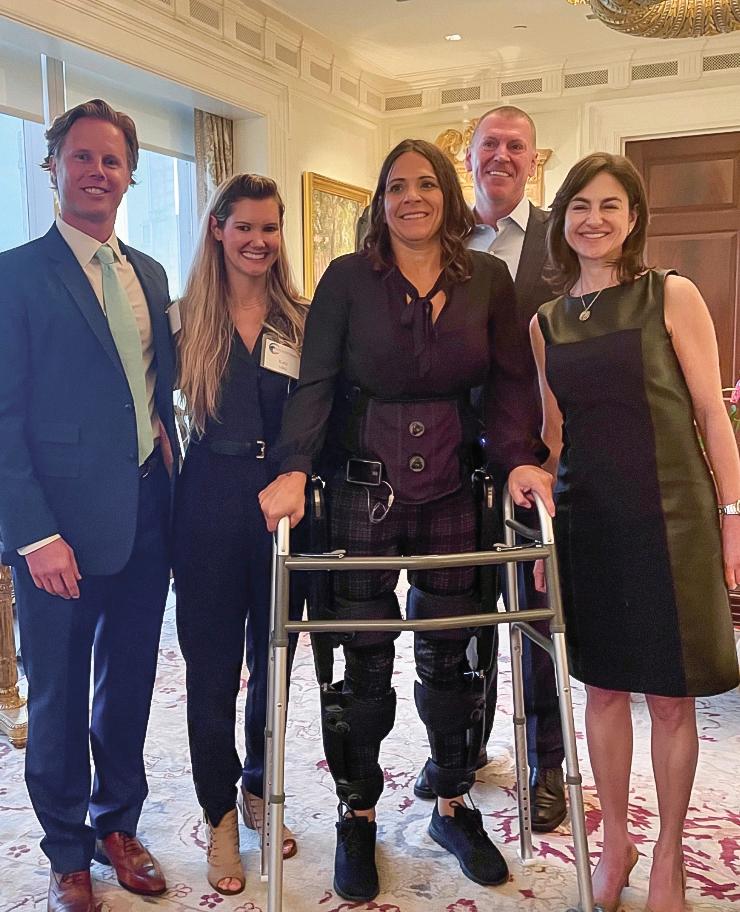 U.S. Navy veteran Laura Cowen (center) demonstrates the SoldierSuit in fall 2023. (Courtesy of Chris Meek)