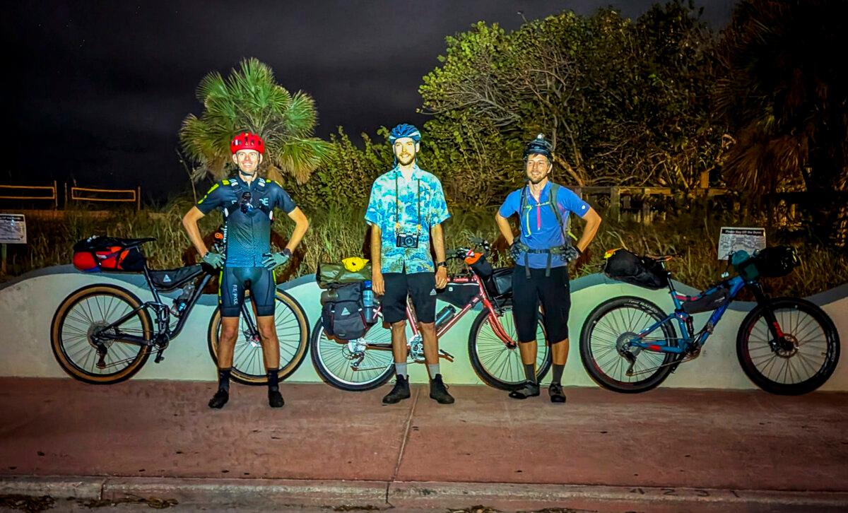 (L–R) Kevin Bolton, Ben Chalone, and Patrick Connolly stand for a group photo at Upham Beach Park in St. Pete Beach before beginning a bike ride across Florida. (Patrick Connolly/Orlando Sentinel/TNS)