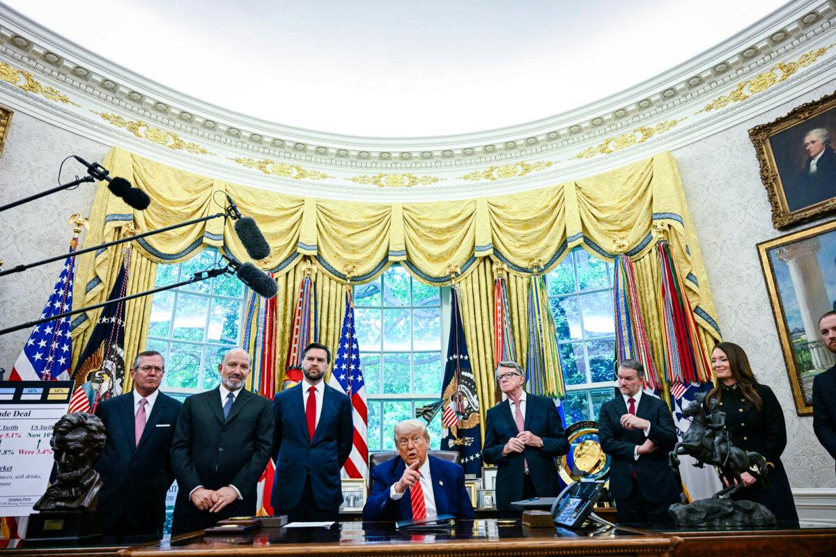 President Donald Trump (C) announces a trade agreement with the UK as (2nd L–R) Secretary of Commerce Howard Lutnick, Vice President JD Vance, British Ambassador to the United States Peter Mandelson, U.S. Trade Representative Jamieson Greer, and Secretary of Agriculture Brooke Rollins look on in the Oval Office on May 8, 2025. (Jim Watson/AFP via Getty Images)