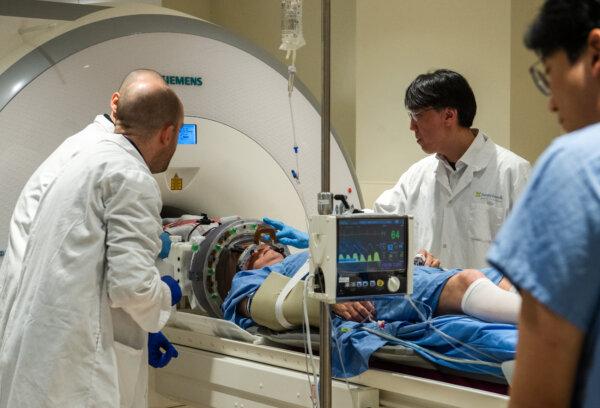 A focused ultrasound helmet is attached to an MRI scanner as part of an early-stage clinical trial exploring the delivery of immunoglobulin to the brain of a patient with ALS at Sunnybrook Health Sciences Centre in Toronto on May 7, 2025. (The Canadian Press/Laura Proctor)