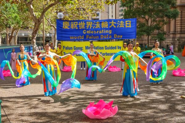 Falun Gong practitioners held a rally to celebrate the 33rd anniversary of Falun Dafa’s introduction to the public in Sydney on May 10, 2025. (An Pingya/The Epoch Times)