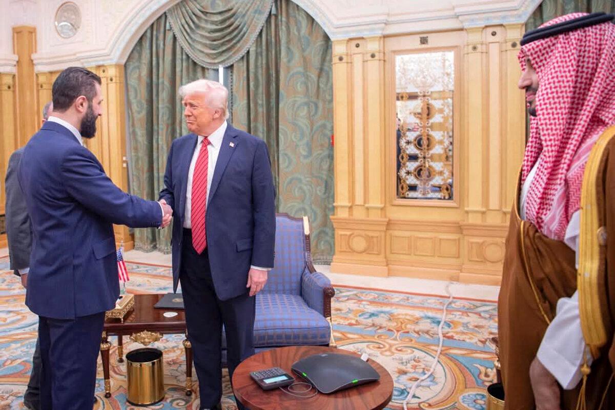 Interim Syrian President Ahmad al-Sharaa (L) shakes hands with President Donald Trump (C) as Saudi Crown Prince Mohammed bin Salman (R) looks on in Riyadh, Saudi Arabia, on May 14, 2025. (Bandar Aljaloud/Saudi Royal Palace via AP)