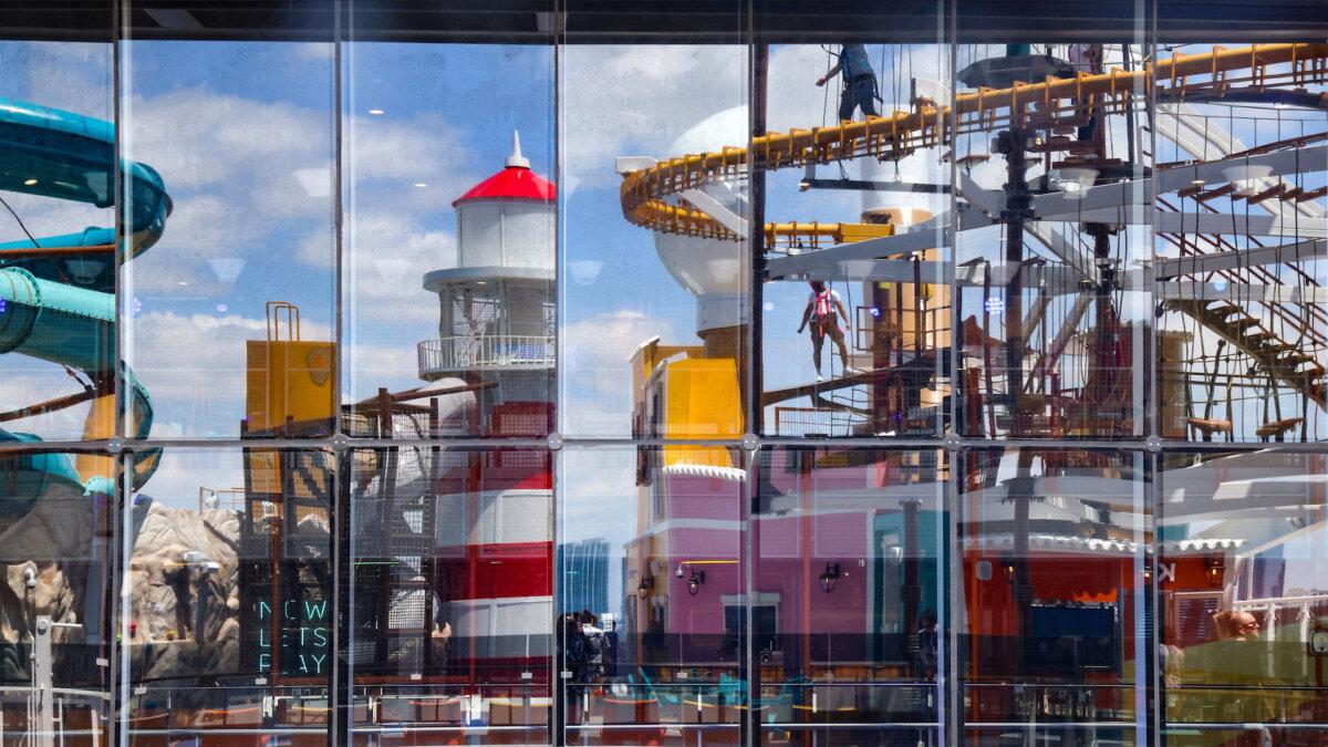 The reflection of Sportplex Adventure Trail is casted on the large window as travelers and visitors enjoy its many attractions. MSC Cruises officially named its highly anticipated new flagship, MSC World America, in a dazzling ceremony at the line’s new state-of-the-art MSC Miami Cruise Terminal on April 9, 2025, at PortMiami. (Carl Juste/Miami Herald/TNS)