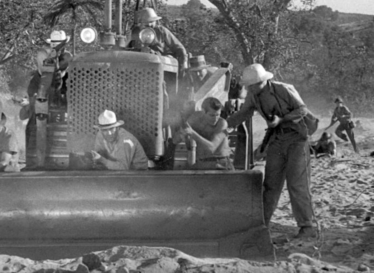 Construction of military bases in WWII features part of the war effort not often seen. The war scenes are gritty in “The Fighting Seabees.” (Republic Pictures)