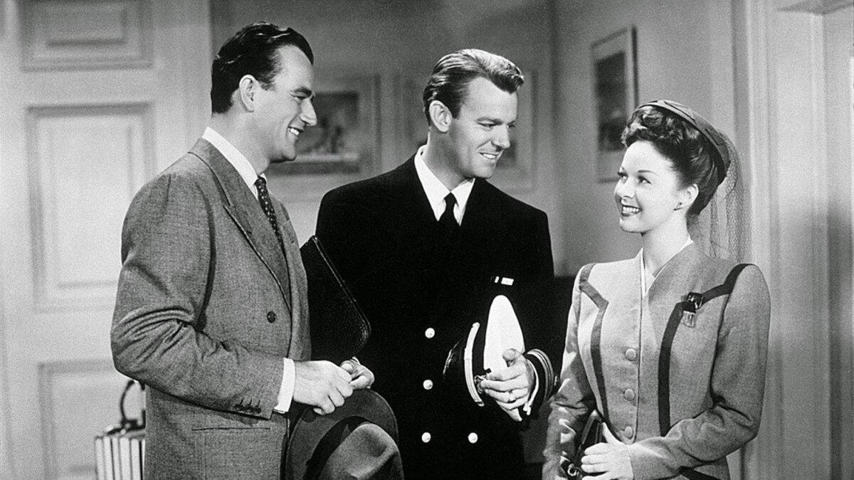 (L–R) Wedge Donovan (John Wayne), Lt. Commander Robert Yarrow (Dennis O’Keefe), and Connie Chesley (Susan Hayward), in “The Fighting Seabees.” (Republic Pictures)