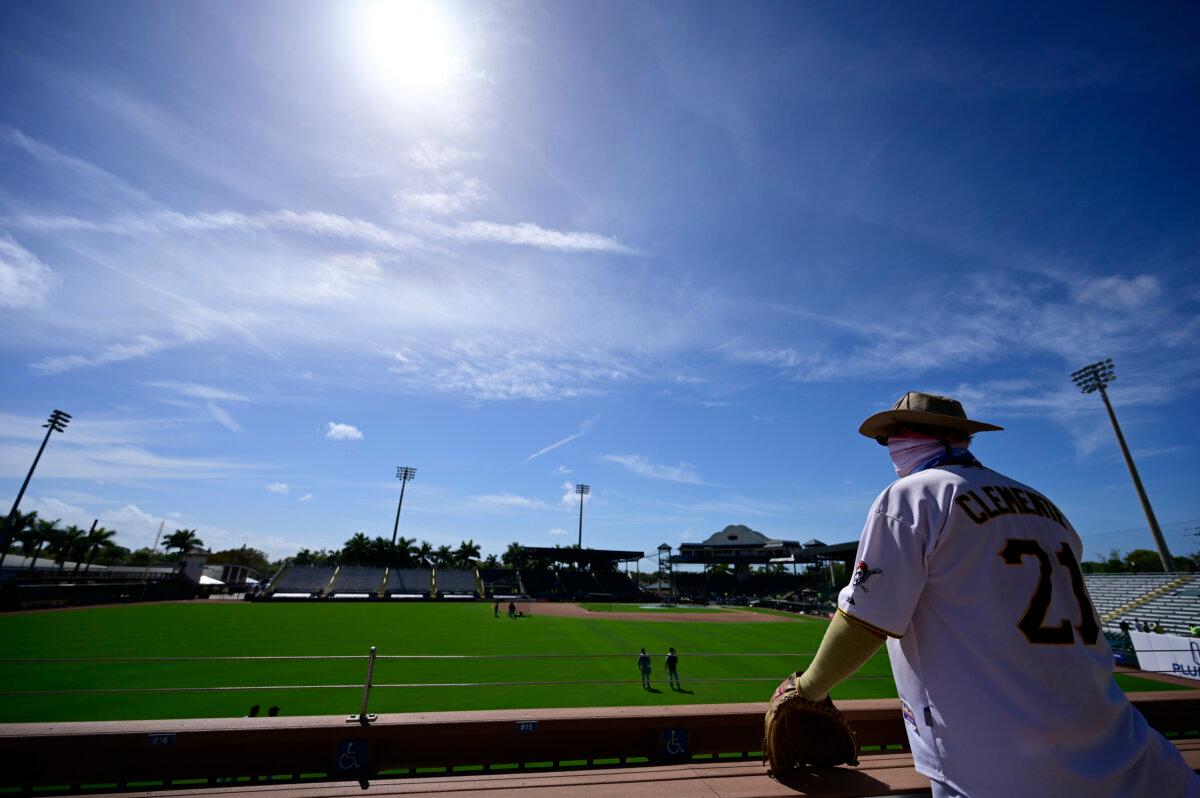 A fan looks on from the outfield stands during the Detroit Tigers batting practice prior to the spring training game between the Pittsburgh Pirates and the Detroit Tigers at LECOM Park in Bradenton, Florida, on March 02, 2021. (Douglas P. DeFelice/Getty Images)