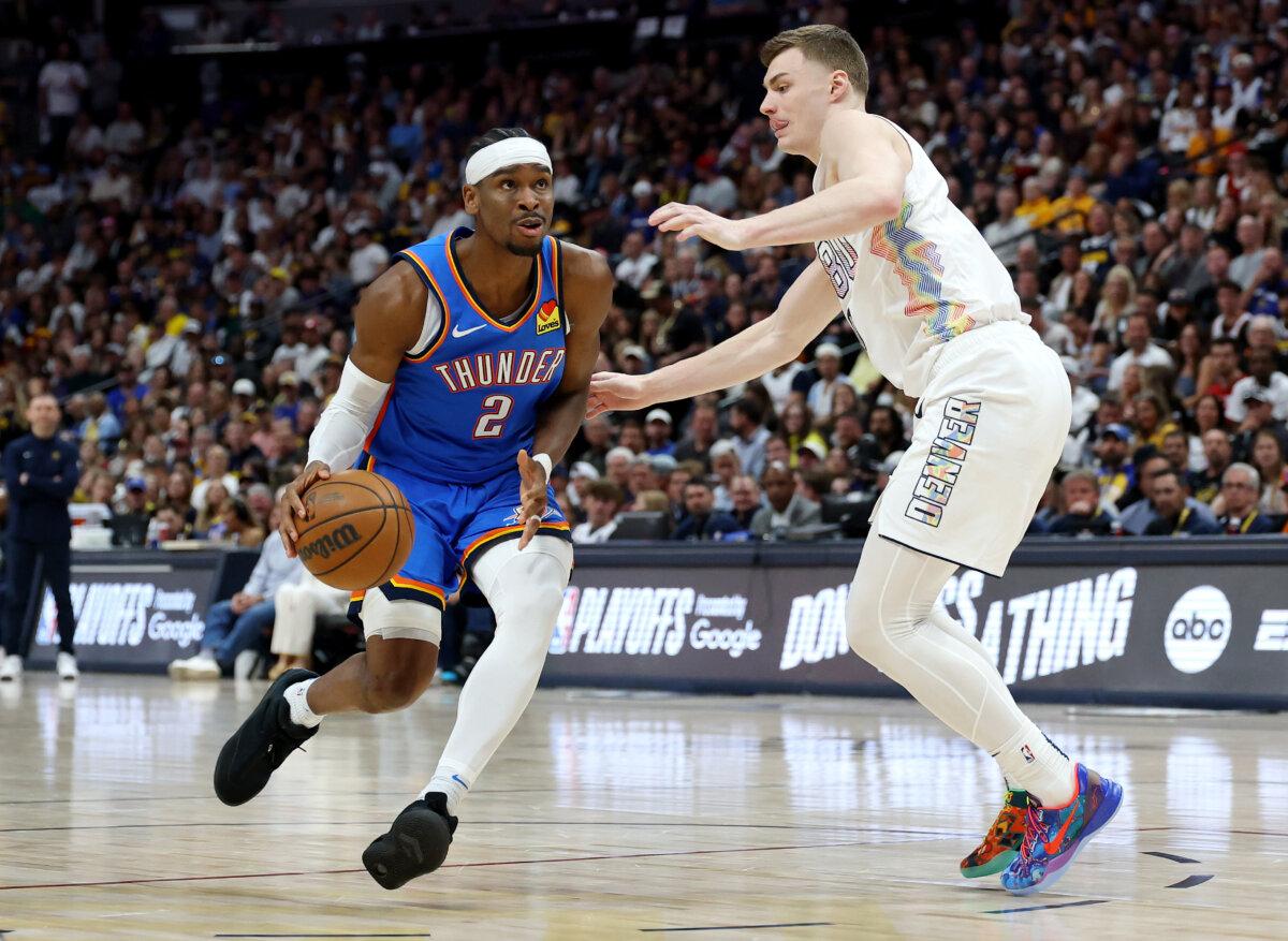 Christian Braun (0) of the Denver Nuggets defends against Shai Gilgeous-Alexander (2) of the Oklahoma City Thunder during the third quarter in Game Six of the Western Conference Second Round NBA Playoffs at Ball Arena in Denver, Colorado, on May 15, 2025. (Matthew Stockman/Getty Images)