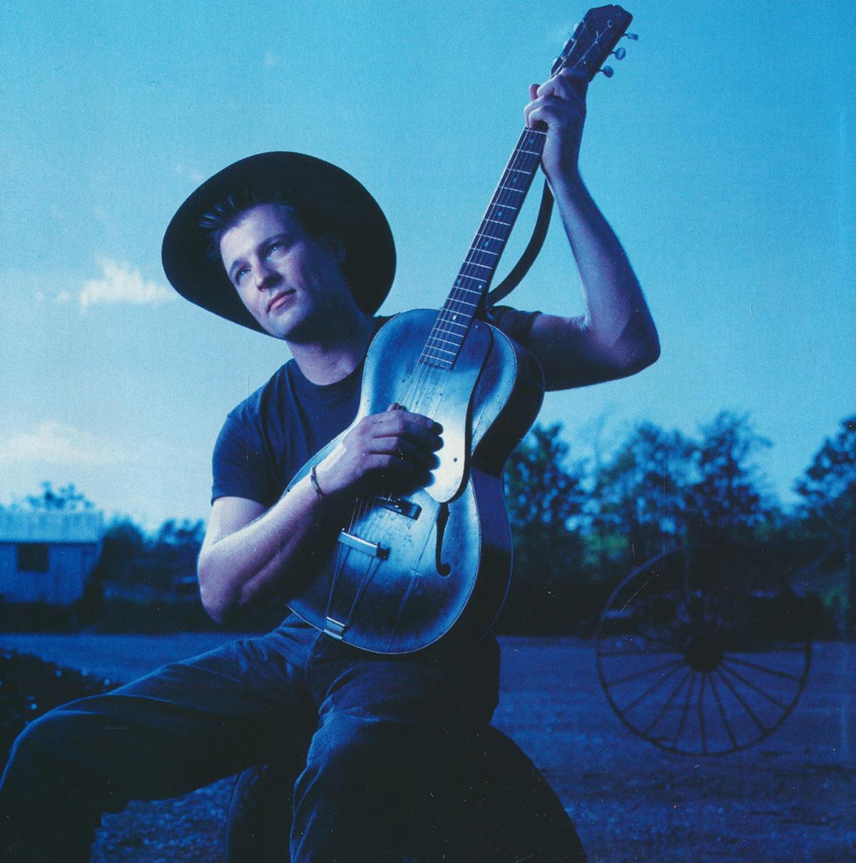 A compact disc insert with John Michael Montgomery’s portrait from his 1992 album "Life's A Dance." Internet Archive. (Public Domain)