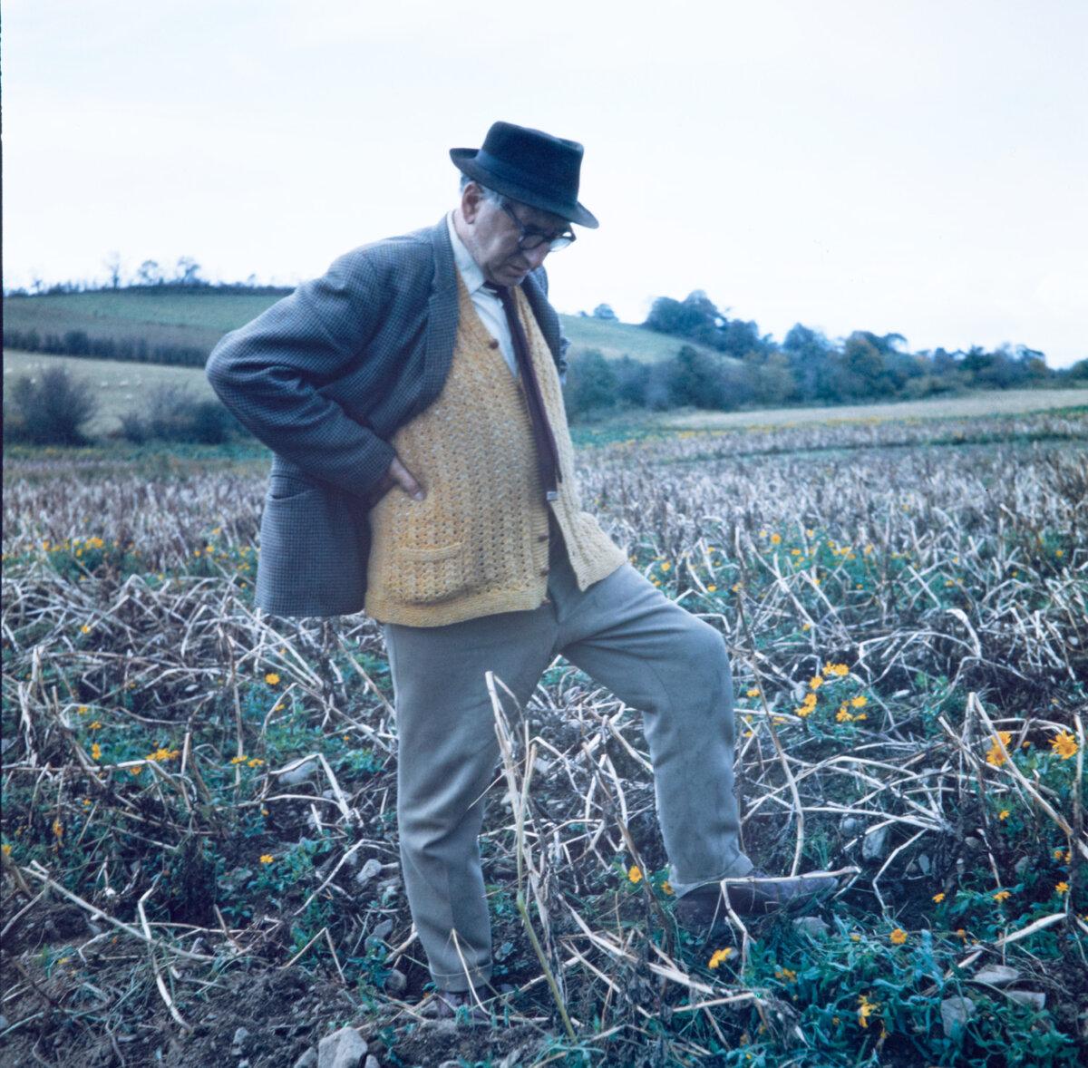 The poet "pondering the Stony Grey Soil of Monaghan at his native Inniskeen" in 1963. (National Library of Ireland on The Commons/No restrictions)
