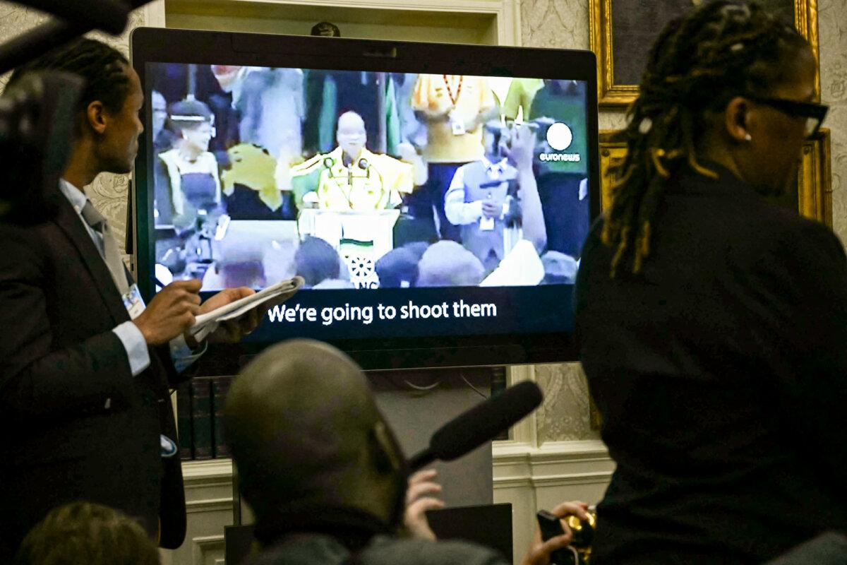 A video plays as South African President Cyril Ramaphosa meets with President Donald Trump in the Oval Office of the White House on May 21, 2025. (Jim Watson/AFP via Getty Images)